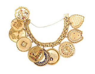* A 14 Karat Charm Bracelet with Ten Attached Charms, 151.00 dwts.