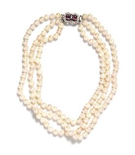 An 18 Karat White Gold, Ruby, Diamond and Cultured Pearl Triple Strand Necklace,