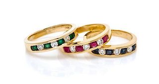 * A Collection of 14 Karat Yellow Gold, Emerald, Sapphire, Ruby and Diamond Rings, 7.30 dwts.
