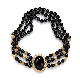 A 14 Karat Yellow Gold and Onyx Bead Triple Strand Necklace, 53.20 dwts.