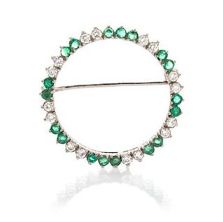 A White Gold, Emerald and Diamond Circle Brooch, 3.30 dwts.