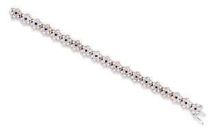 A 14 Karat White Gold, Diamond and Sapphire Bracelet, 12.40 dwts.