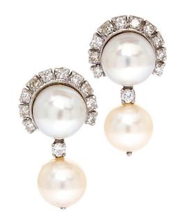A Pair of 14 Karat White Gold, Diamond and Cultured Pearl Earclips, 6.55 dwts.