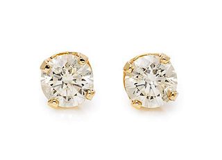 A Pair of 14 Karat Yellow Gold and Diamond Stud Earrings, 1.30 dwts.