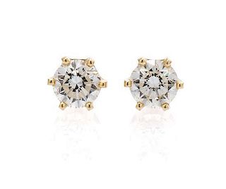 A Pair of 14 Karat Yellow Gold and Diamond Stud Earrings, 1.10 dwts.