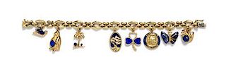 A 14 Karat Yellow Gold Charm Bracelet with 8 Attached Charms, 23.50 dwts.
