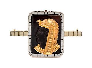 An Egyptian Revival Platinum Topped Gold and Onyx Brooch, 13.70 dwts.