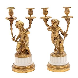 A Pair of Louis XV Style Gilt Bronze and Marble Two-Light Candelabra Height 16 3/4 x width 8 1/2 x depth 6 inches.