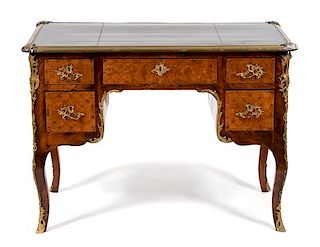 A Louis XV Style Gilt Metal Mounted Parquetry Leather Top Desk Height 30 x width 41 1/2 x depth 23 inches.
