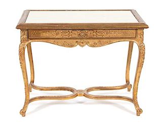 A Louis XV Style Carved Giltwood Center Table Height 30 x width 39 1/2 x depth 25 inches.