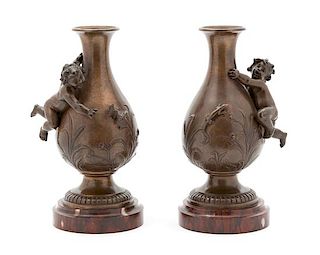 A Pair of Continental Bronze Urns Height 9 x diameter 4 1/2 inches.