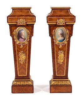 A Pair of Louis XVI Style Gilt Bronze and Porcelain Mounted Kingwood Pedestals Height 45 1/2 x width 13 x depth 11 1/2 inches.