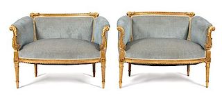 A Pair of Louis XVI Style Giltwood Marquise Armchairs Height 27 x width 38 x depth 24 1/2 inches.