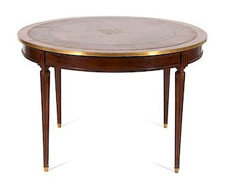 A Louis XVI Style Brass Mounted Circular Table Height 29 x diameter 43 1/2 inches.