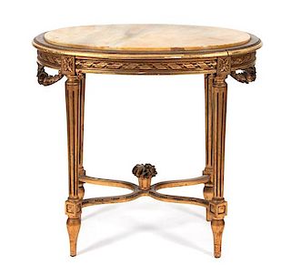 A Louis XVI Style Giltwood and Marble Top Oval Center Table Height 30 x width 31 1/2 x depth 21 inches.