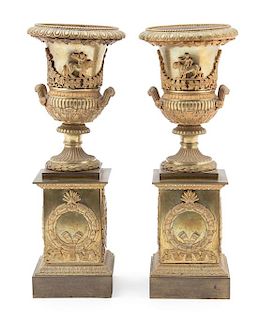 A Pair of French Empire Gilt Bronze Campana-form Urns on Pedestal Bases Height 13 1/4 x diameter 5 inches.