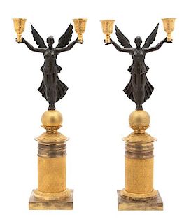 A Pair of French Empire Patinated and Gilt Bronze Two-Light Candelabra Height 17 1/2 x width 7 x depth 4 1/4 inches.