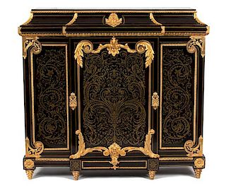 A Napoleon III Gilt Bronze Mounted and Cut Brass Inlaid Ebony Cabinet Height 52 x width 55 x depth 17 inches.