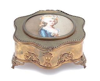 A French Gilt Metal Cartouche-form Jewel Box Height 3 x width 5 x depth 4 1/2 inches.