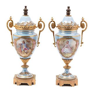 A Pair of Sevres Style Gilt Bronze Mounted Porcelain Urns Height 12 1/2 inches.