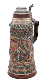 A Polychrome Stoneware Beer Stein with Pewter Lid Height 14 1/2 x diameter 6 1/2 inches.