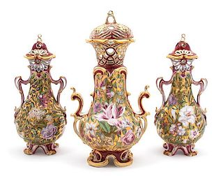 A Chelsea Porcelain Three Piece Garniture Height of largest 16 1/8 inches.