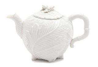 A Chelsea Molded Relief Porcelain Teapot Height 5 inches.