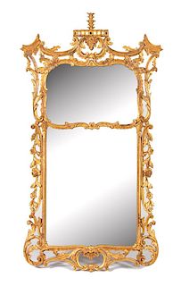 A George II Style Carved Giltwood Wall Mirror Height 65 1/2 x width 37 inches.