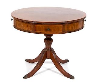 A Regency Style Crossbanded Mahogany Drum Table Height 29 1/2 x diameter 36 inches.