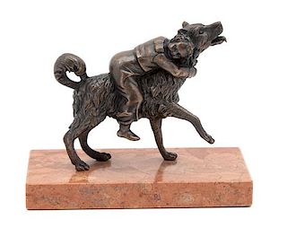 A Bronze Figure of a Dog with a Boy on His Back Height 4 x width 6 1/4 x depth 3 inches.