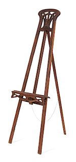 An Art Nouveau Carved Mahogany Painting Easel Height 68 x width 22 1/2 inches.
