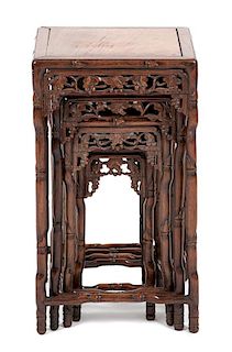 A Nest of Four Chinese Faux Bamboo Carved Hardwood Quartetto Tables Height of largest 18 x diameter squared 10 inches.