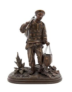 A French Gilt and Patinated Bronze Figure of an Asian Fisherman Height 11 x width 8 x depth 9 inches.