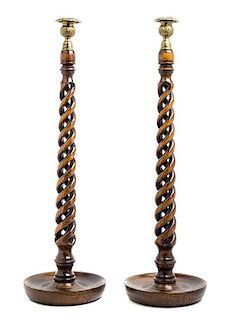 A Pair of English Gilt Metal Mounted Oak Candlesticks Height 22 1/2 inches.