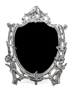 An Art Nouveau Silvered-Metal Mirror Height 13 inches.