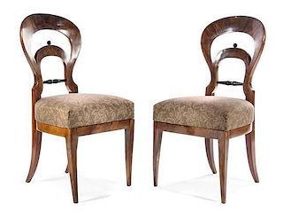 A Pair of Biedermeier Parcel Ebonized Walnut Side Chairs Height 36 1/2 inches.