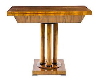 A Biedermeier Parcel Ebonized Flip-Top Game Table Height 31 x width 37 1/2 x depth 18 3/4 inches.