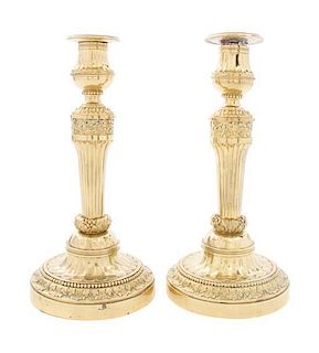 A Pair of Louis XVI Style Gilt Metal Candlesticks Height 12 1/2 inches.