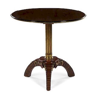 A Neoclassical Brass Banded Walnut Pedestal Table Height 27 3/4 x diameter 32 inches.