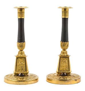 A Pair of Neoclassical Gilt and Patinated Bronze Candlesticks Height 12 1/8 inches.