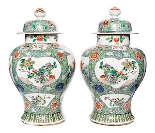 A Pair of Famille Verte Porcelain Vases and Covers Height 17 3/4 inches.