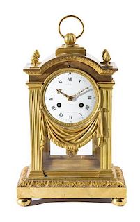 A French Gilt Bronze Mantel Clock Height over handle 14 1/2 inches.