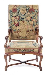 A Henry II Style Walnut Open Armchair Height 45 inches.