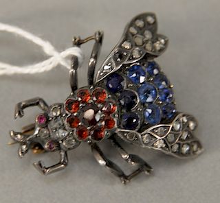 Silver fly brooch set with diamonds, blue, and red stones. lg. 31.9mm