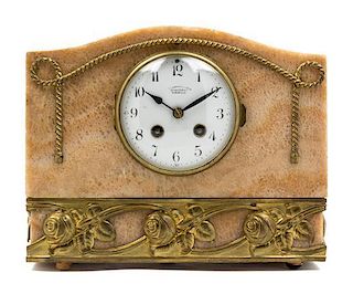 An Art Deco Gilt Metal Mounted Stone Mantel Clock Width 10 7/8 inches.