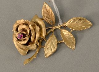 14 karat gold rose pin, set with ruby red stone. length 2 inches, 13.7 grams