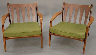 Pair of Kofod Larsen armchairs, dry seat cushions.