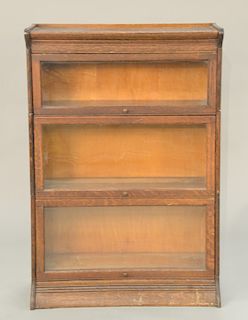 Oak three section stacking bookcase. ht. 50 1/2 in., wd. 34 in.