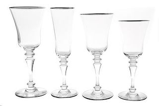A Baccarat Glass Stemware Service Height of champagne flutes 8 3/4 inches.