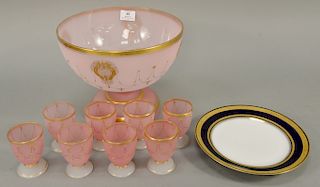 Pink bristol glass punch bowl (ht. 9 in., dia. 11 in.) and eight cups and twelve German lunch plates (dia. 9 1/2 in.).